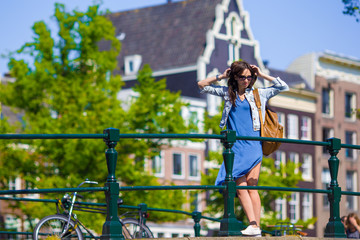 Young beautiful woman walking in european city, Amsterdam