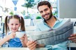 © WavebreakmediaMicro - Happy father and his daughter having breakfast together