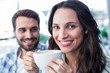 © WavebreakmediaMicro - Cute couple having coffee together