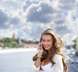 © Andrey_Arkusha - Happy beautiful girl calling by phone
