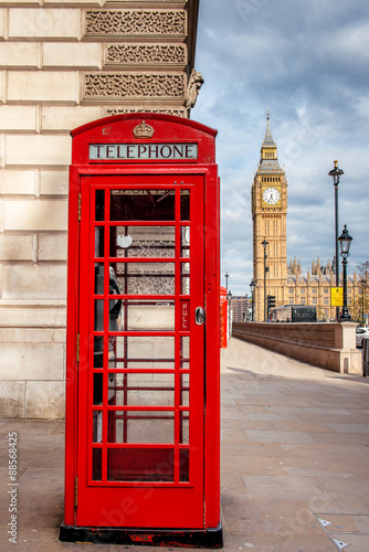 Fototapeta na wymiar Red Telephone Cabin in London with Big Ben in the background