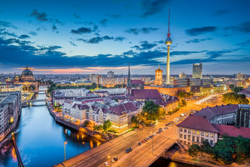 Fototapete - Berlin skyline panorama with dramatic clouds in twilight at dusk, Germany
