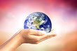 © buraratn - We love the world of ideas.world in human hands. Natural background blur. Elements of this image furnished by NASA.