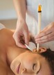 © WavebreakmediaMicro - Young woman getting an ear candling treatment