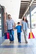 © WavebreakmediaMicro - Happy family with shopping bags