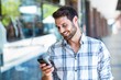 © WavebreakmediaMicro - Hipster man using his smartphone in the city