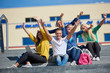 © .shock - students outside sitting on steps