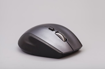 Black computer mouse on gray background