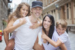 © Louis-Paul Photo - Summer family portrait of parents and kids outside in urban style