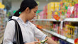 © glowonconcept - Asian girl, woman shopping snacks in supermarket
