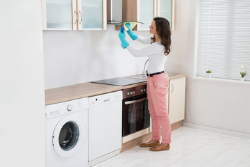 Wall Mural - Woman Cleaning Cooker Hood