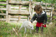 girl with lamb on the farm