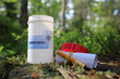 Geocaching and geocache container in forest