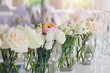 Wedding flower arrangement , pink ranunculus, white roses