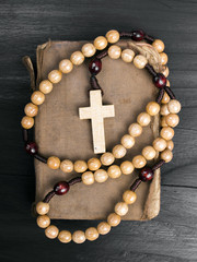 Wall Mural - rosary and prayer book on a dark background