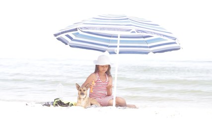 Poster - girl and dog and sunscreen on the sea