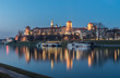 Royal castle of the Polish kings on the Wawel hill, over the Vistula river in the evening