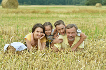 Wall Mural - Happy family in wheat field