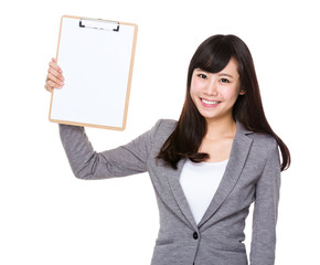 Young businesswoman show with blank page of clipboard