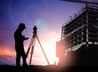 © Yuttana Studio - silhouette survey engineer working  in a building site over Blur