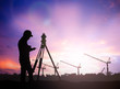 silhouette survey engineer working  in a building site over Blur