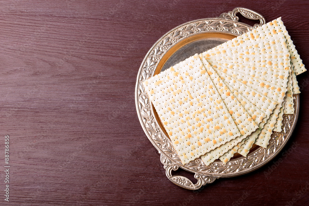 Matzo for Passover on metal tray on table close up