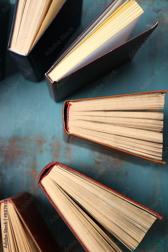 Heart of books, on wooden background