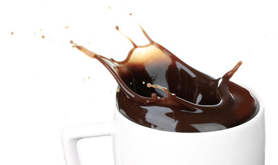 Wall Mural - Splash of hot chocolate in cup isolated on white