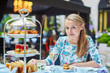 © Ekaterina Pokrovsky - Beautiful young woman enjoying afternoon tea