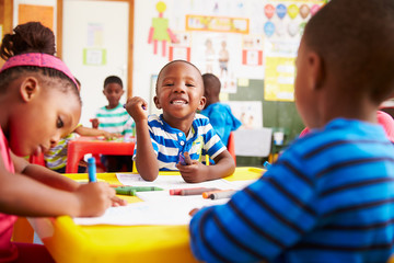 preschool class in south africa, boy looking to camera