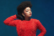 © ysbrandcosijn - Elegant woman with Afro hair wearing fuzzy tops