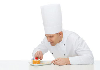 Poster - happy male chef cook decorating dessert