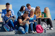 © .shock - students outside sitting on steps