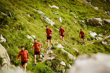 Poster - sequence of a man running on a mountain trail