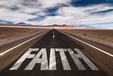 Fototapeta  - Faith written on desert road