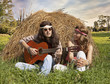 Hippie couple  playing guitar