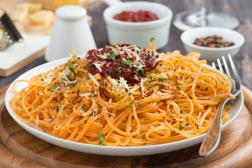 Italian food - pasta with tomato sauce and cheese, close-up