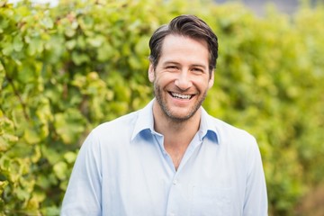 Young happy man smiling at camera