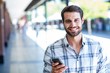 © WavebreakmediaMicro - Hipster man using his smartphone in the city
