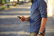 © opolja - Close up of a man using mobile smart phone