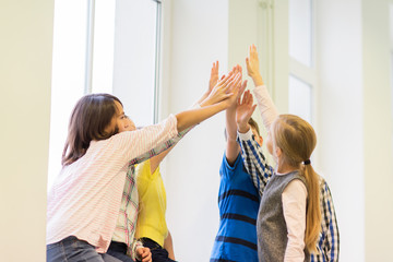 Sticker - group of school kids making high five gesture