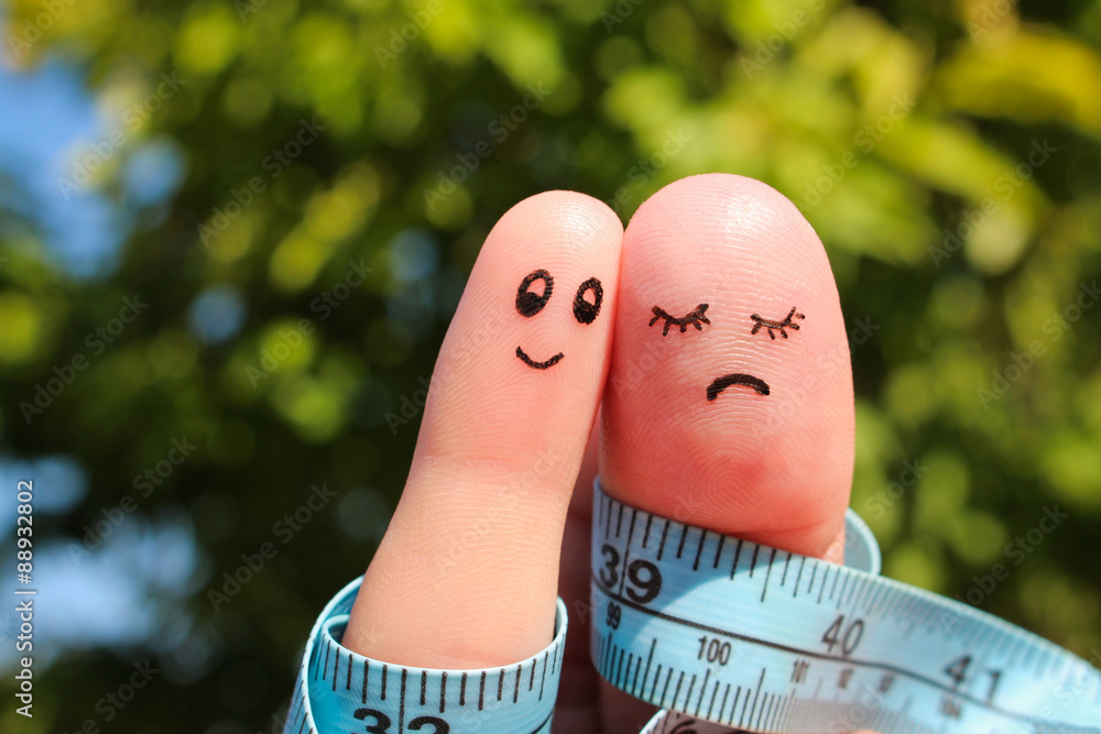 Finger art of couple with meter. The concept man is thin, woman is fat. - obrazy, fototapety, plakaty 
