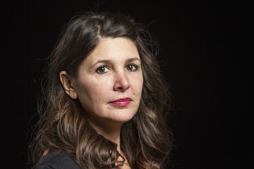 Studio portrait of a serious Caucasian female