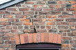 step cracking damage to brickwork in a wall above a window as a result of subsidence