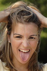 Woman sticking out tongue in fun.