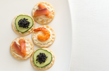 Wall Mural - Canape with seafood on the plate