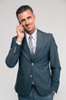 © Drobot Dean - Portrait of a happy businessman talking on the phone