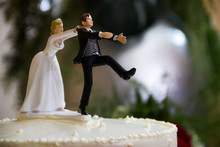 Bride Catches Groom Wedding Cake Topper.