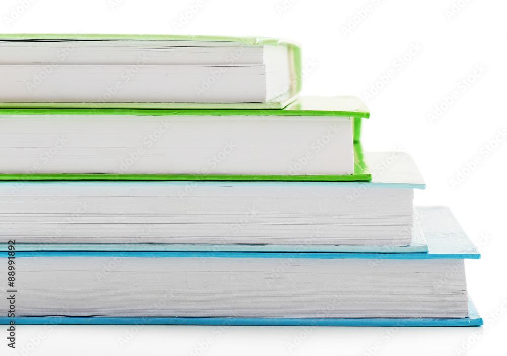 Stack of colorful books isolated on white