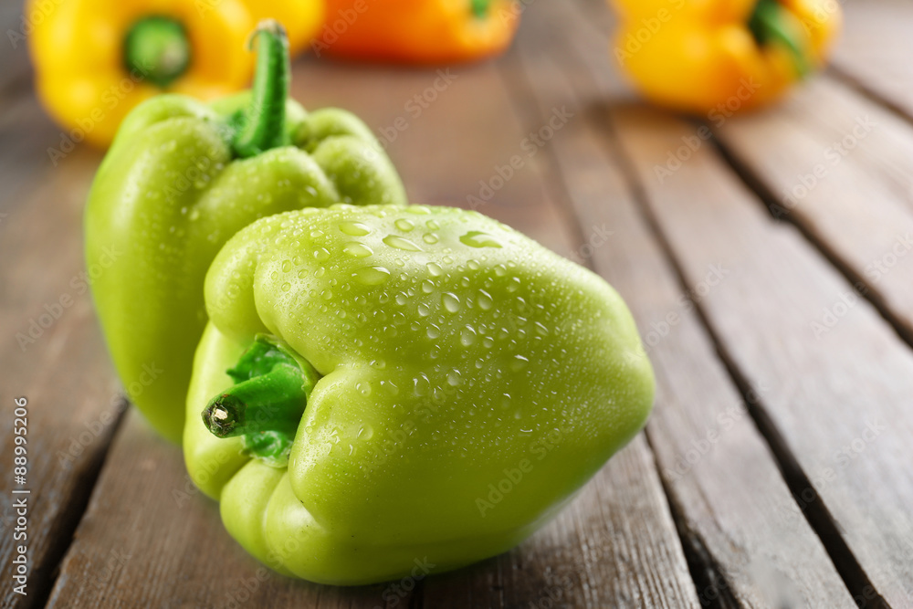 Colorful peppers on rustic wooden table, closeup
